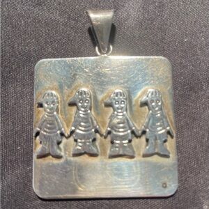 Sterling silver hanging pendant with four children